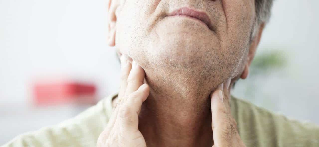 Get to Know the Medical Doctors Who Treat Hearing Loss Man feels throat