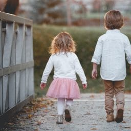 Children walking on a bridge