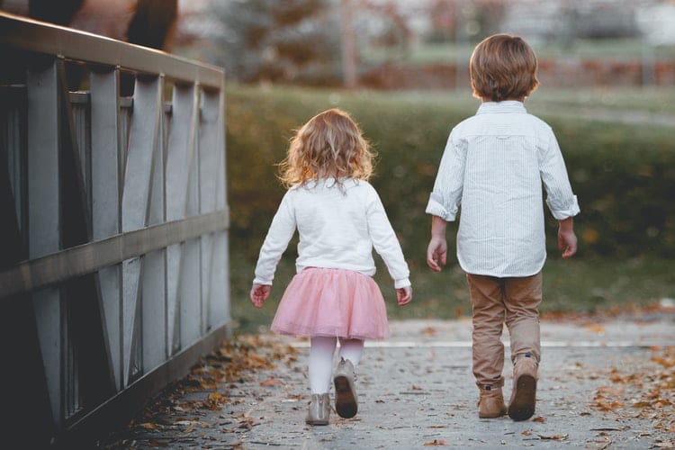 Helping Your Child Through Their Hearing Loss Children walking on a bridge