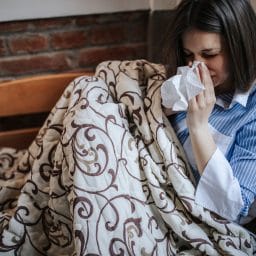 Woman with cough lying down.