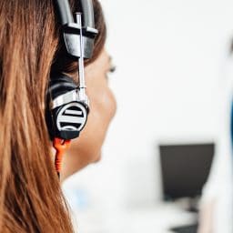 Woman getting a hearing test at an audiologist clinic.