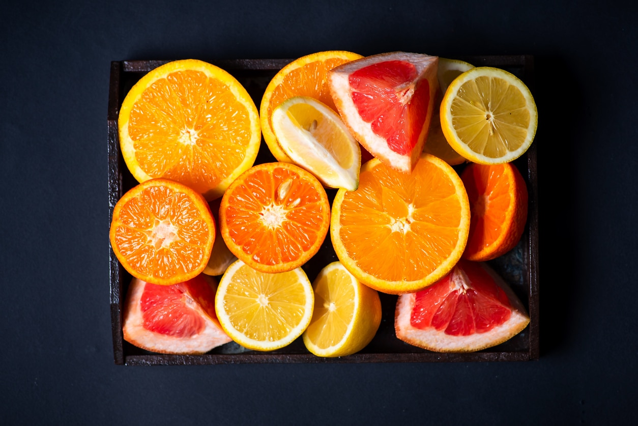 Collection of cut up citrus fruits.