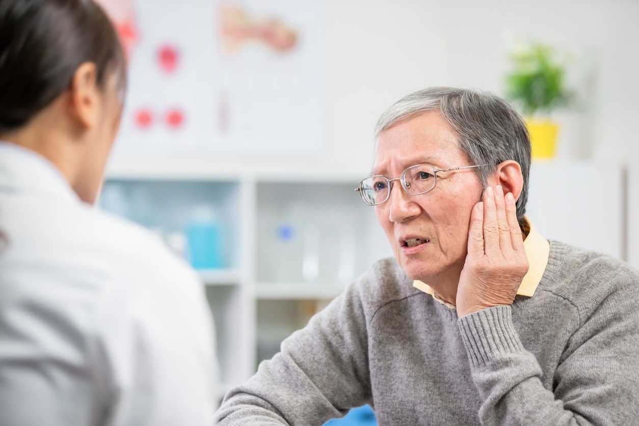 Person with ear pain discussing with an ENT