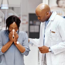 Woman consulting a doctor about allergy testing.
