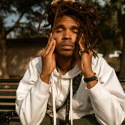 Man with seasonal allergies experiencing a headache.