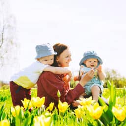 Happy family playing in the public garden